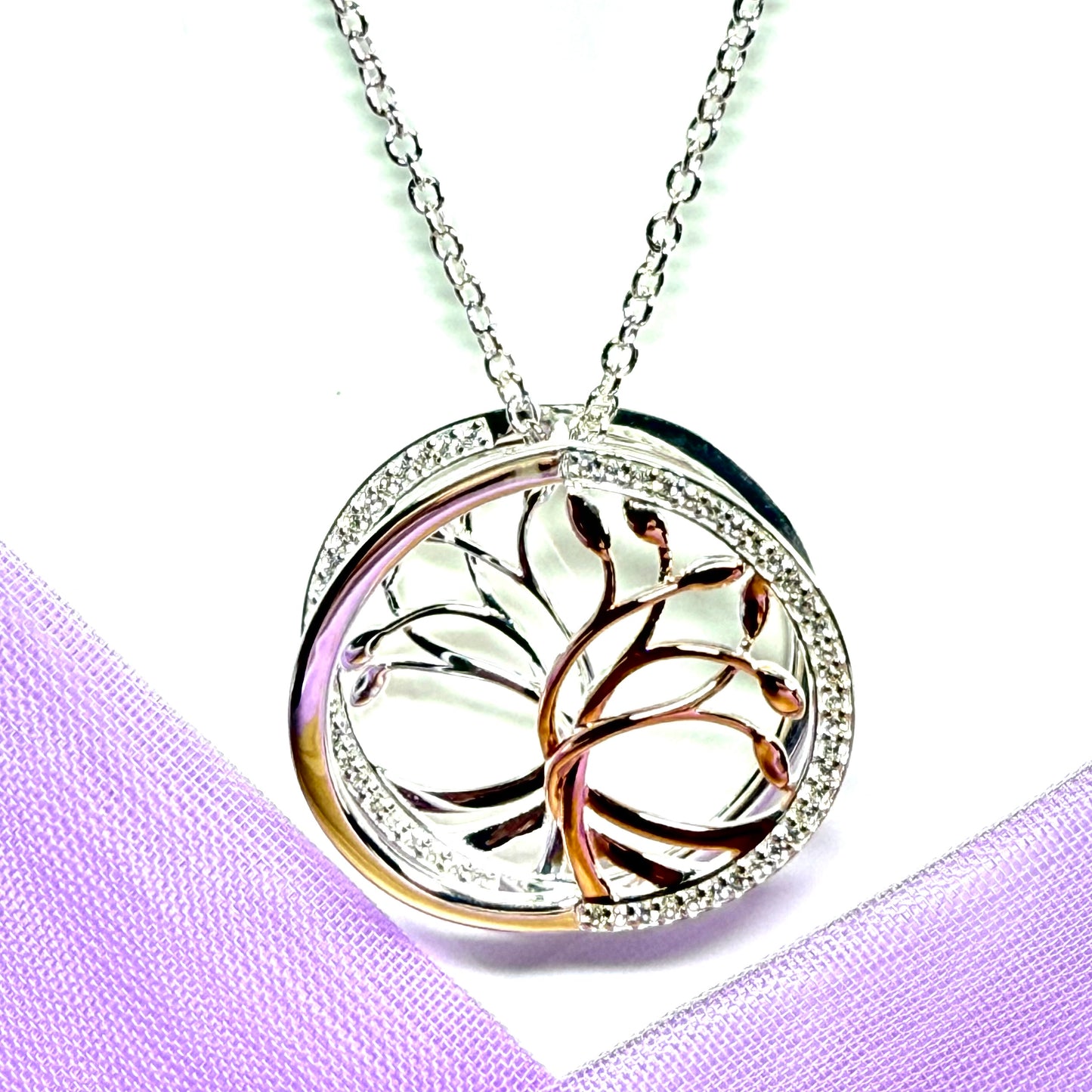 A sterling silver solid round open pierced fancy swirl Tree of Life necklace with a chain
