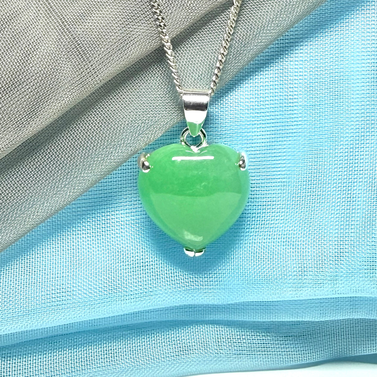 A real green jade necklace heart shaped sterling silver with chain