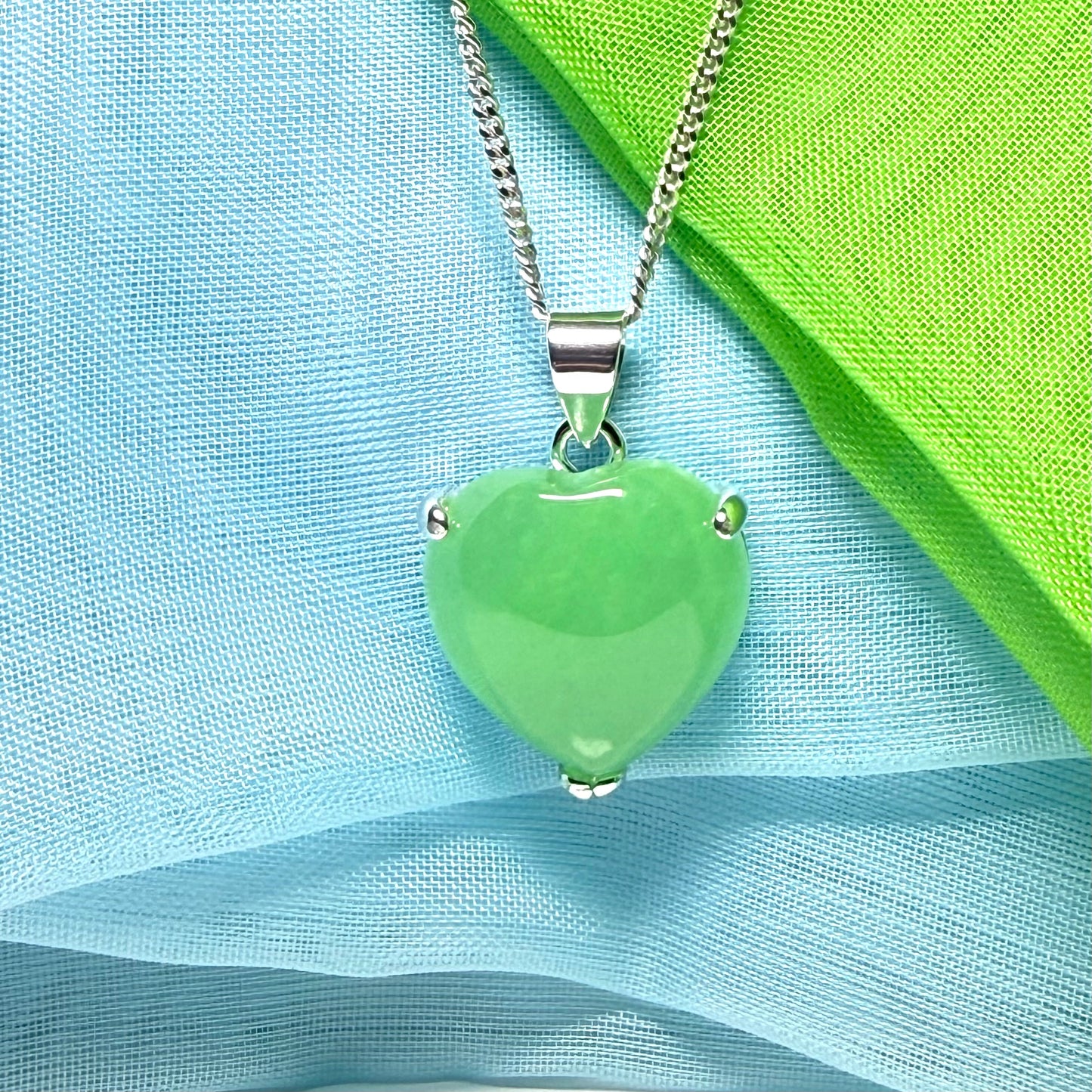A stunning real green jade necklace heart shaped sterling silver with chain included as well
