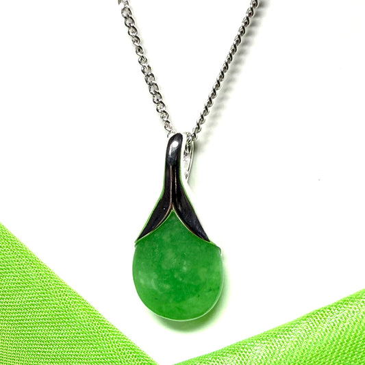 A stunning real green jade necklace in a teardrop or a pear shape including a chain