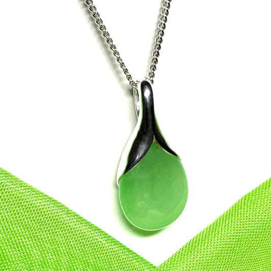 A stunning real green jade necklace in a teardrop or a pear shape including a solid curb chain