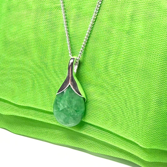 A stunning real green jade necklace with a teardrop or pear shaped pendant part