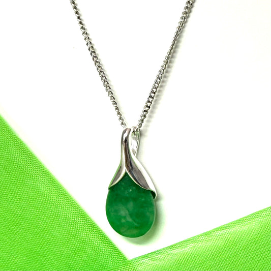 A stunning real green jade necklace with a teardrop pendant pear shape