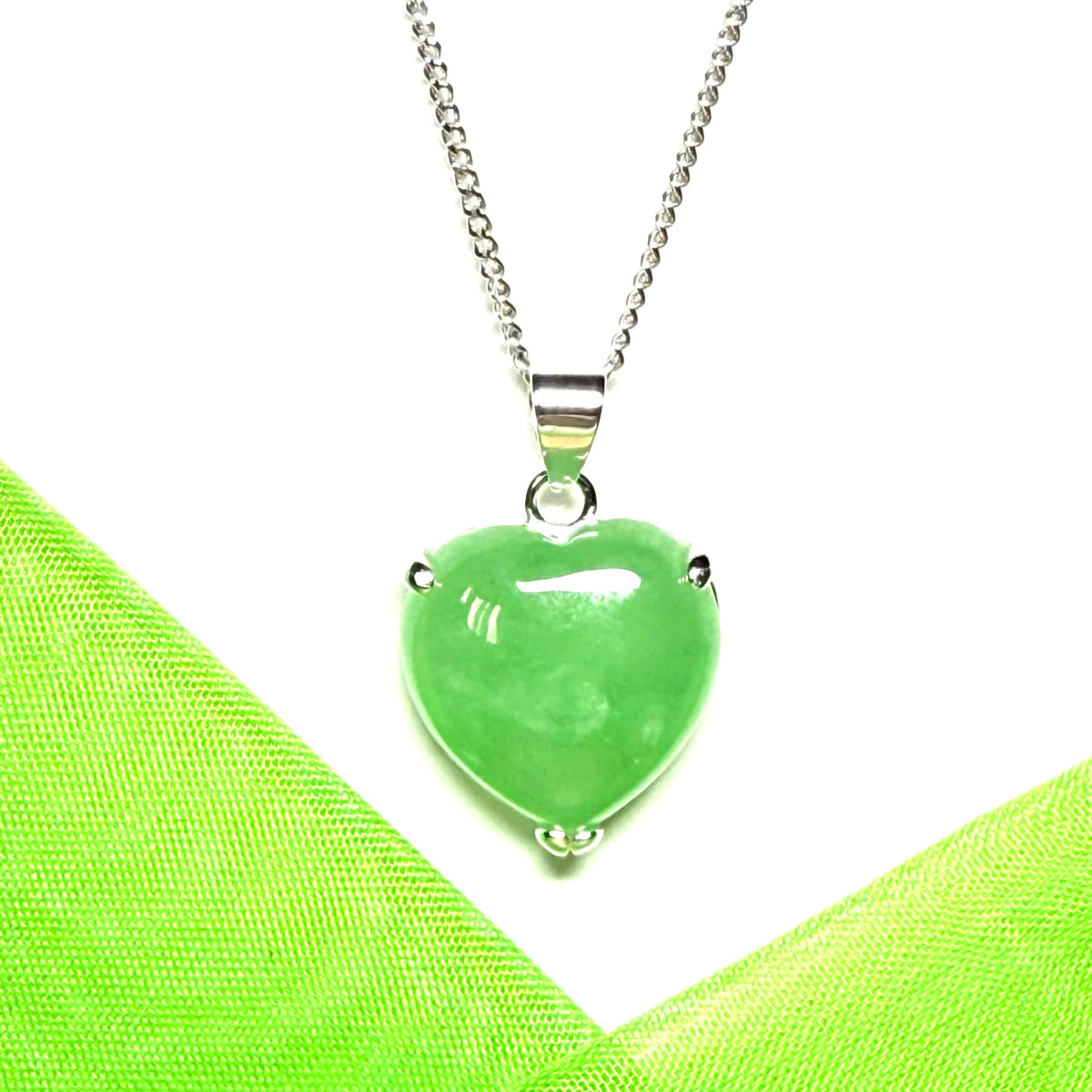 A stunning real light green jade necklace heart shaped sterling silver pendant