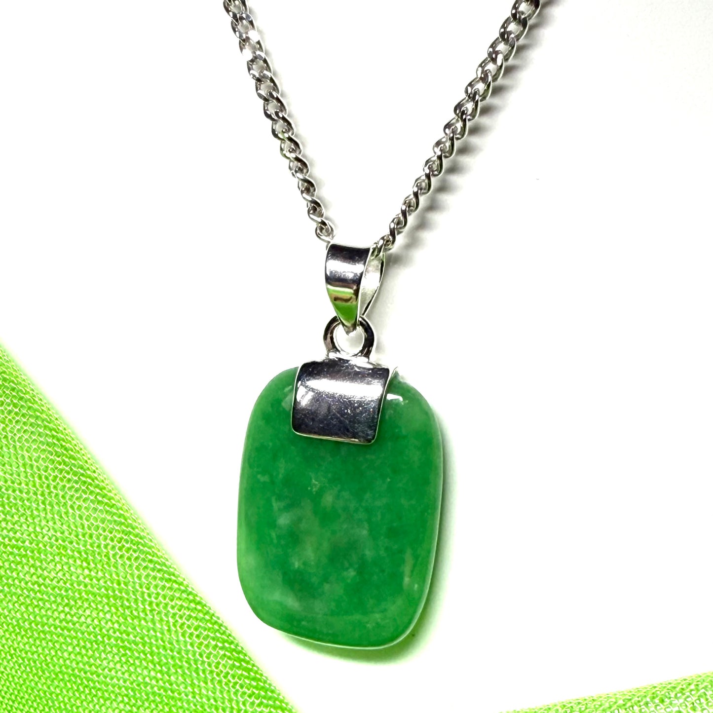 A stunning sterling silver cushion shaped real green jade necklace pendant with a solid curb chain included
