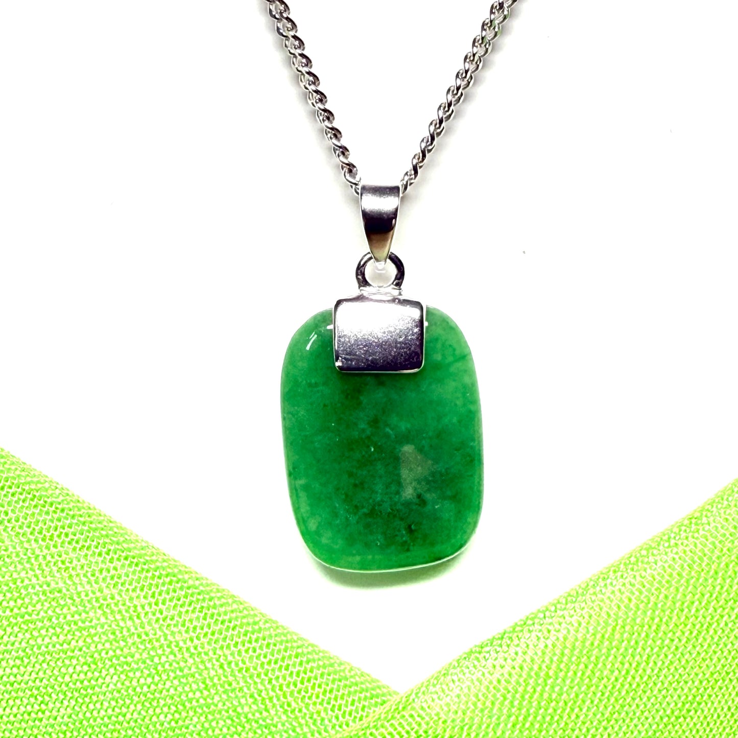 A stunning sterling silver cushion shaped real green jade necklace pendant with a chain included