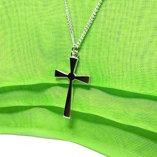 A thick solid sterling silver cross necklace fancy shaped pendant with a chain