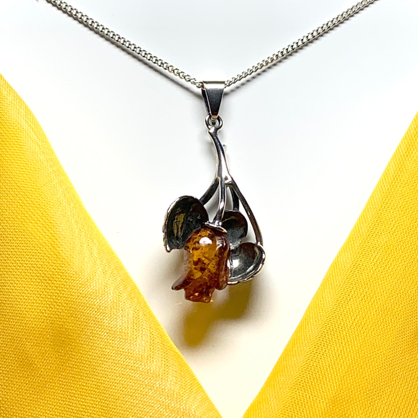 Amber rose shaped necklace sterling silver