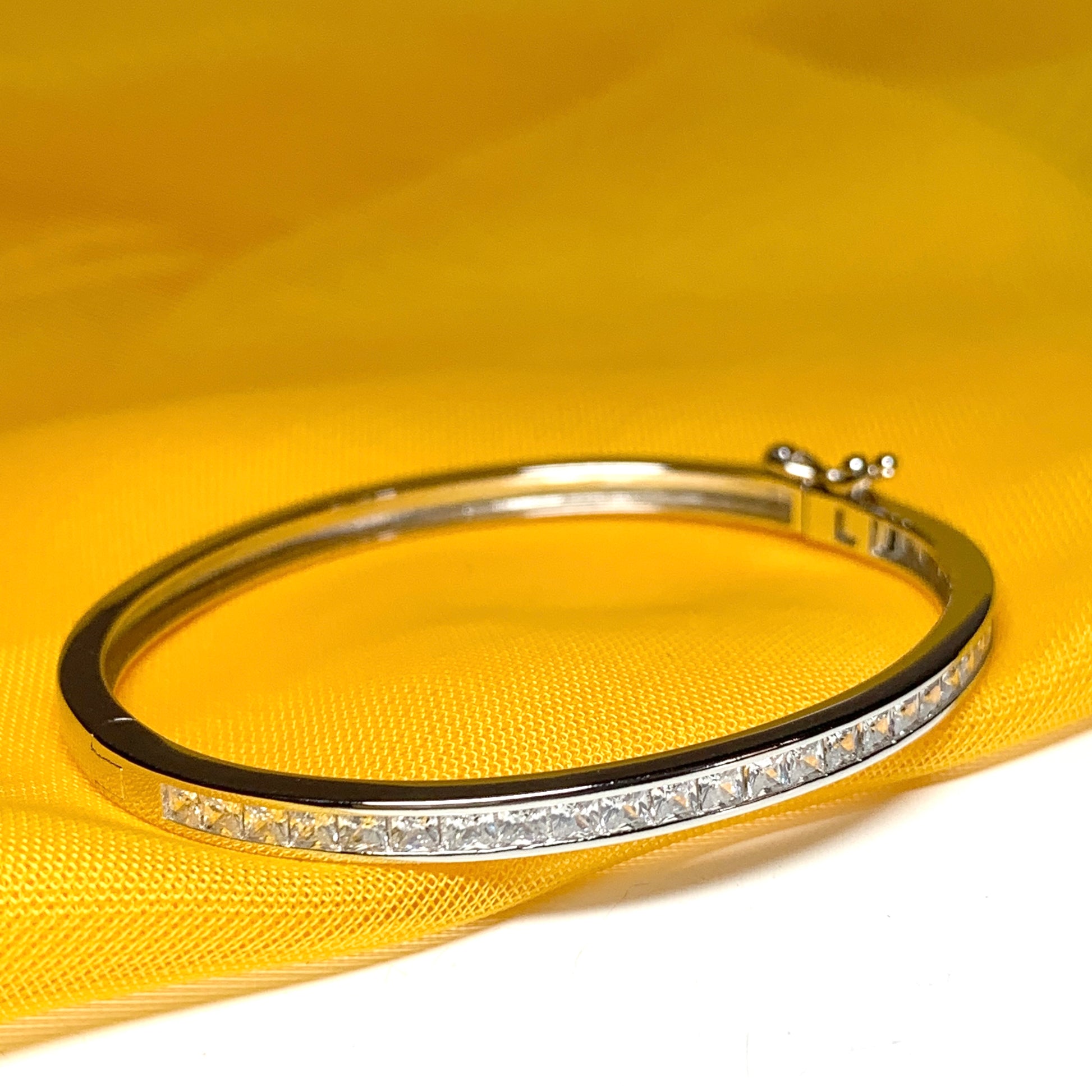 Oval Bangle With Princess Cut Cubic Zirconia Sterling Silver Channel Set