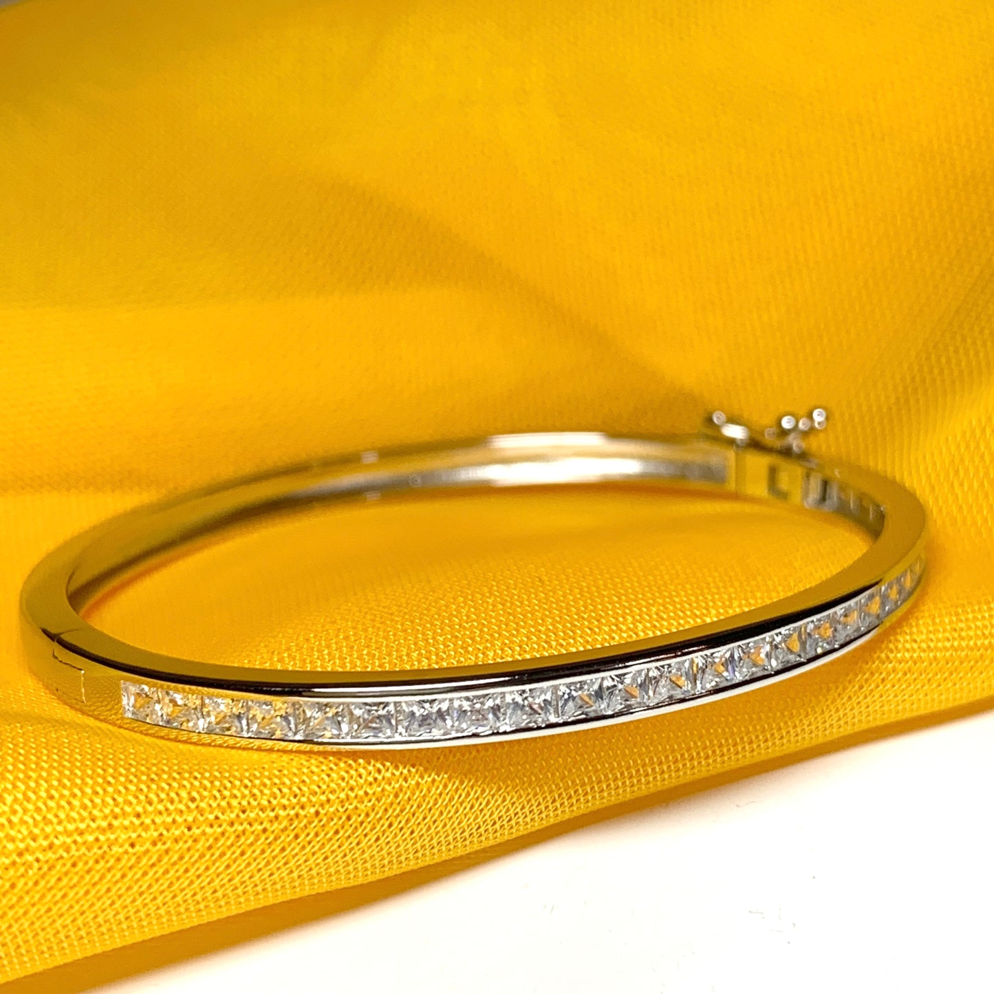 Oval Bangle With Princess Cut Cubic Zirconia Sterling Silver Channel Set