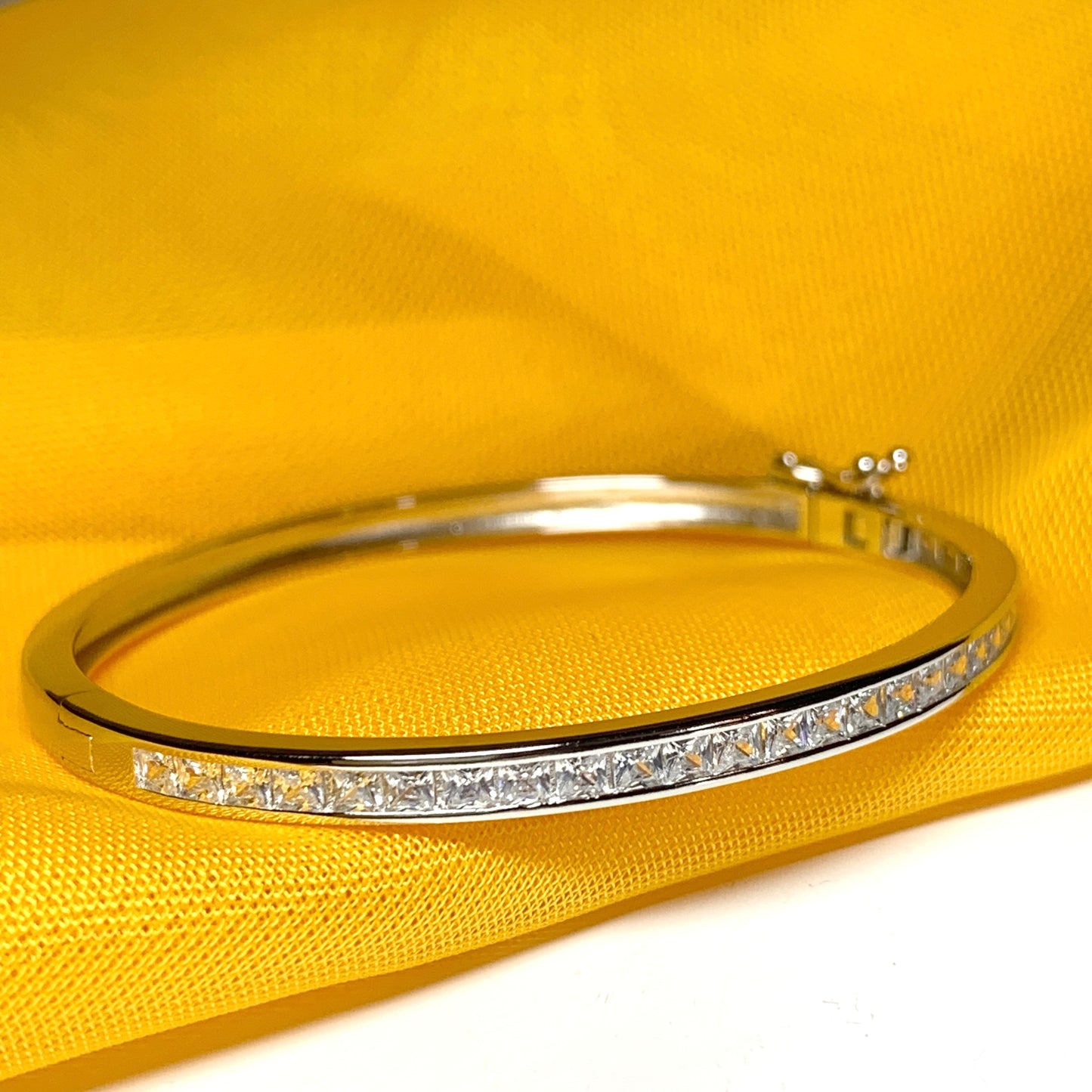 Oval Bangle With Princess Cut Cubic Zirconia Sterling Silver Channel Set