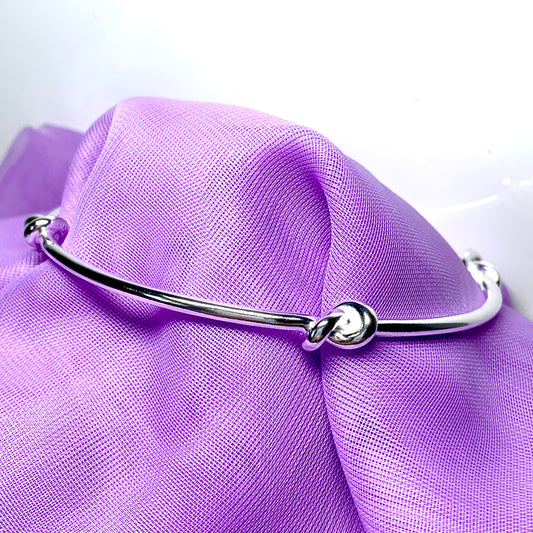 Bangle sterling silver knotted solid round with a classic knot design