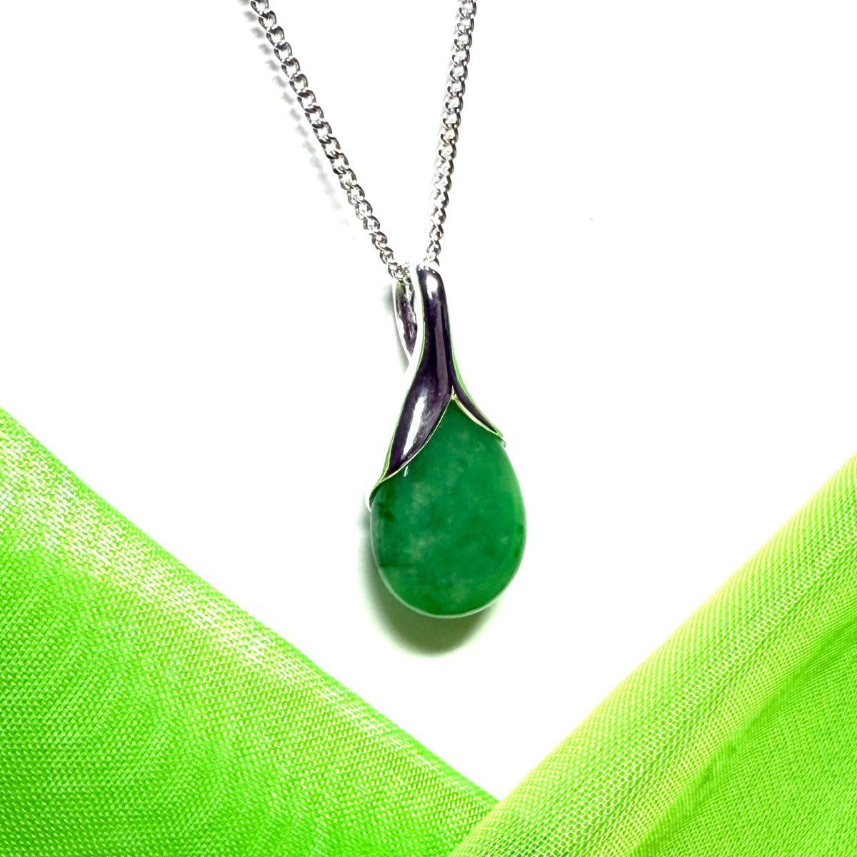 Beautiful and stunning real green jade pendant necklace in a teardrop shaped or pear shaped