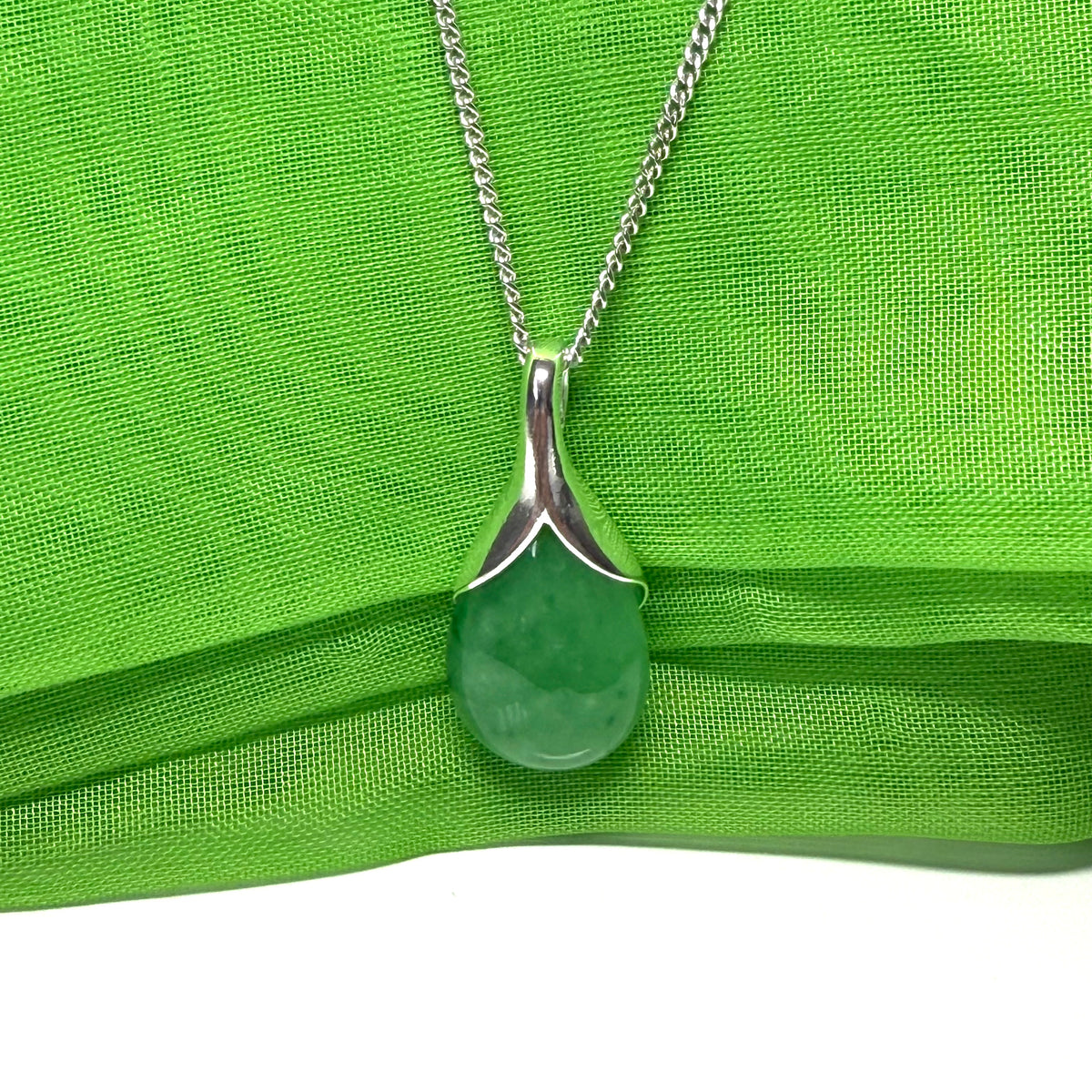 Beautiful and stunning real green jade pendant necklace in a teardrop shaped or pear shaped