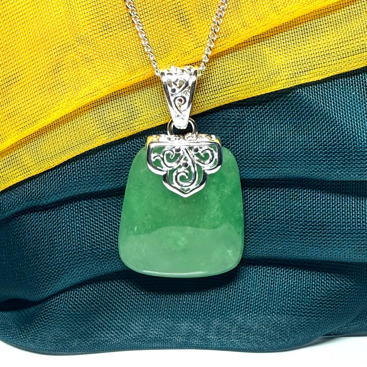 A beautiful and truly timeless real green jade necklace large pendant that is cushion shaped