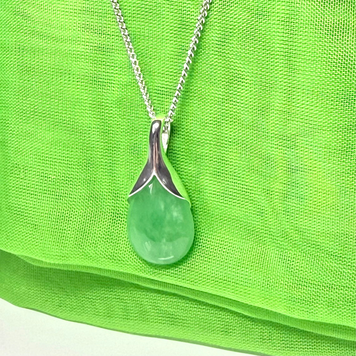 A beautiful real green jade necklace teardrop pendant pear shaped