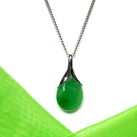 A beautiful real green jade necklace teardrop pendant pear shape with a solid chain