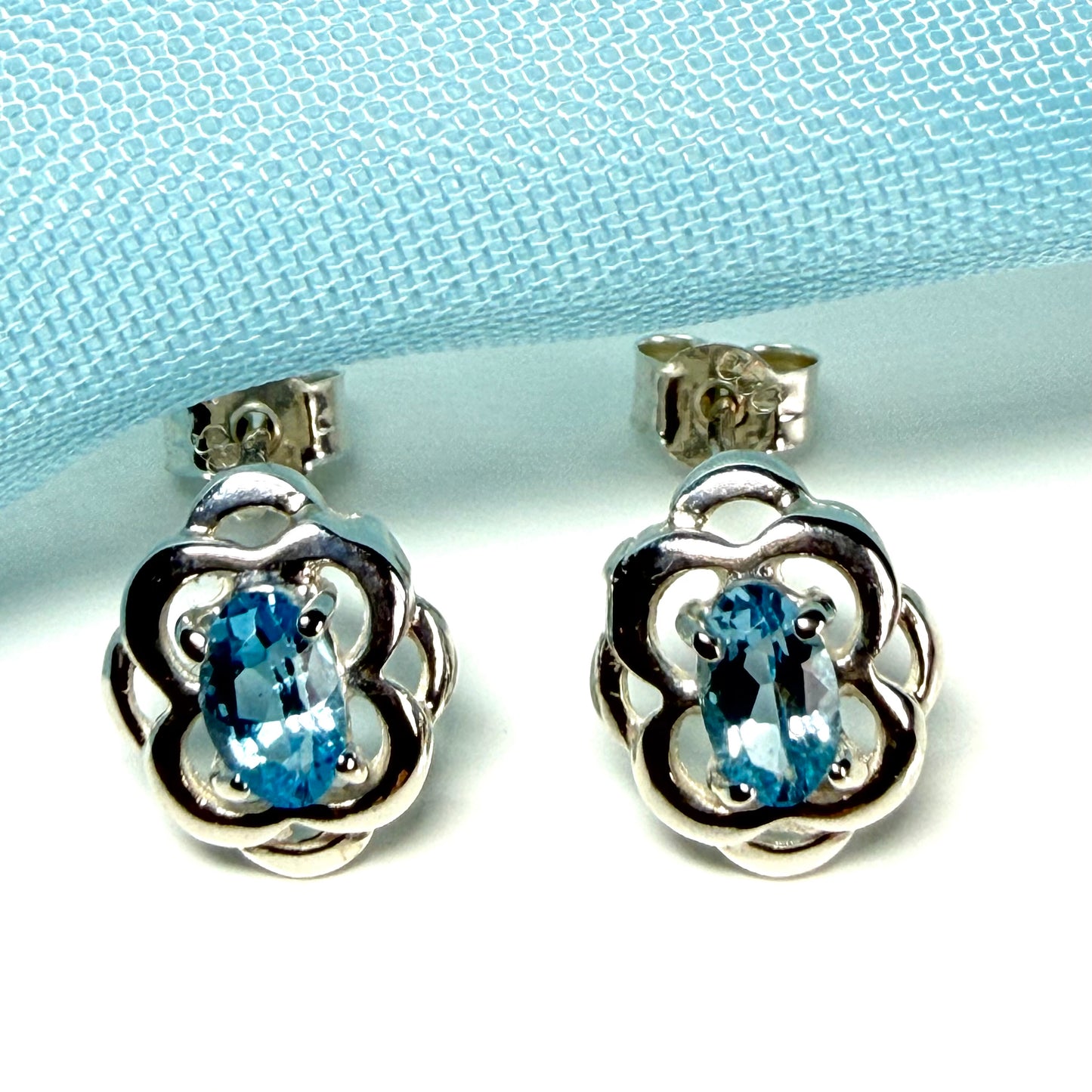 Blue topaz sterling silver oval shaped Celtic stud earrings