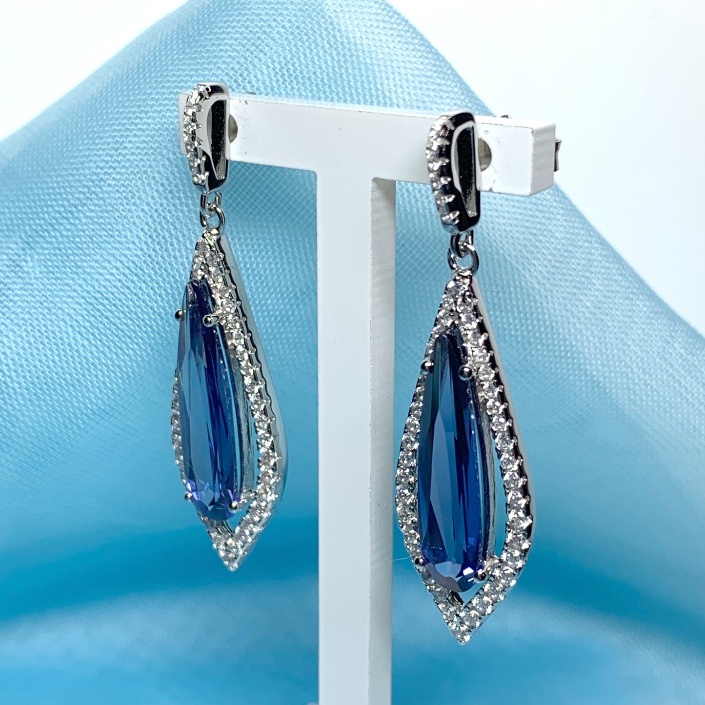 Blue pear shaped cubic zirconia silver cluster long drop earrings