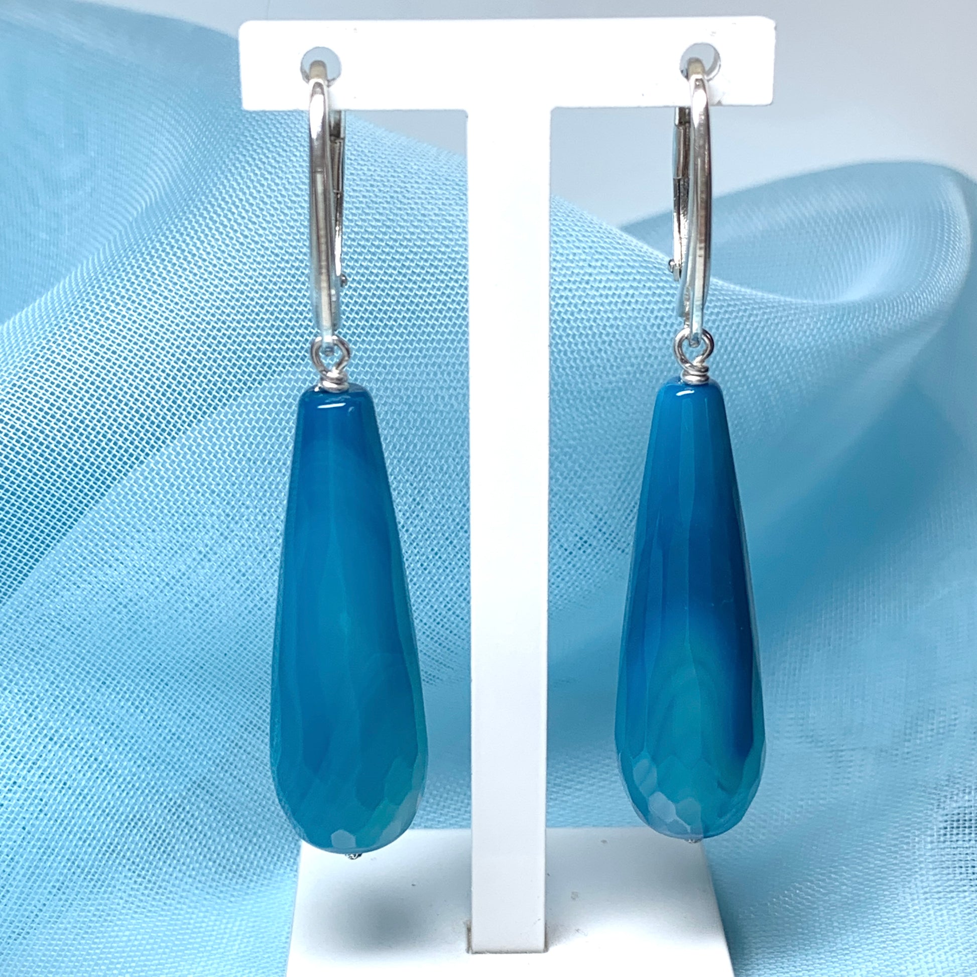 Blue long teardrop shaped agate drop earrings continental fastenings