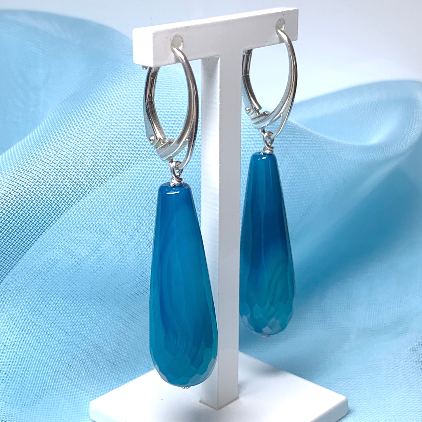 Blue long teardrop shaped agate drop earrings continental fastenings