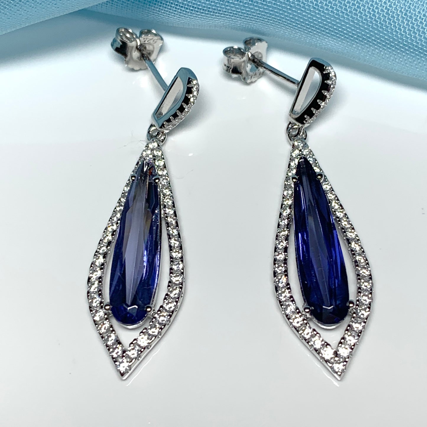 Blue pear shaped cubic zirconia silver cluster long drop earrings