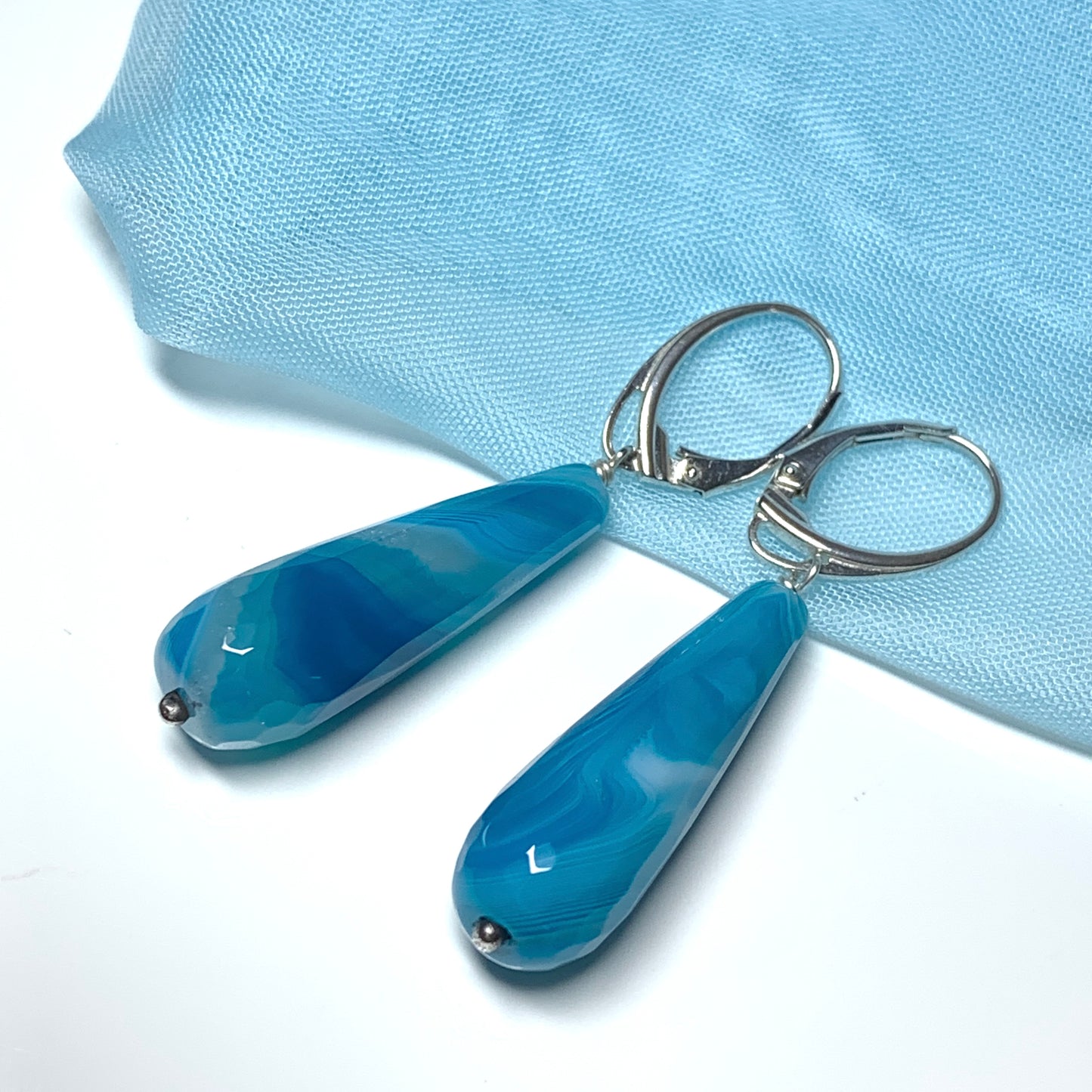 Blue teardrop drop earrings with continental wire fittings long agate stones