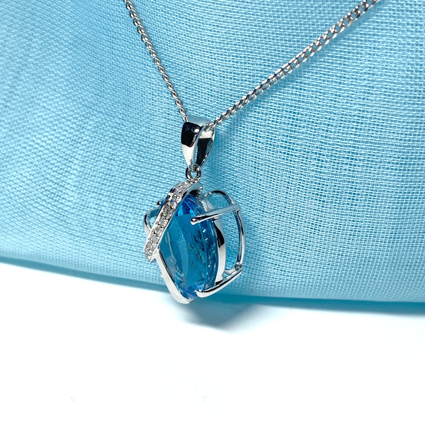 Blue topaz and diamond necklace white gold fancy oval shaped pendant