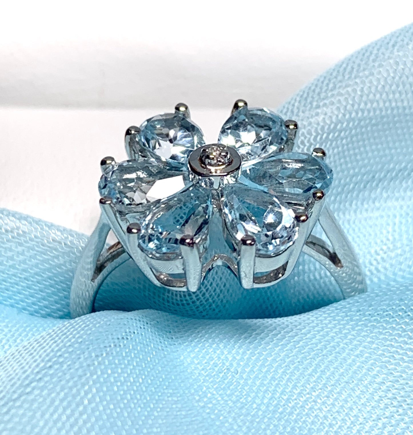 Blue topaz diamond round sterling silver daisy petal cluster ring