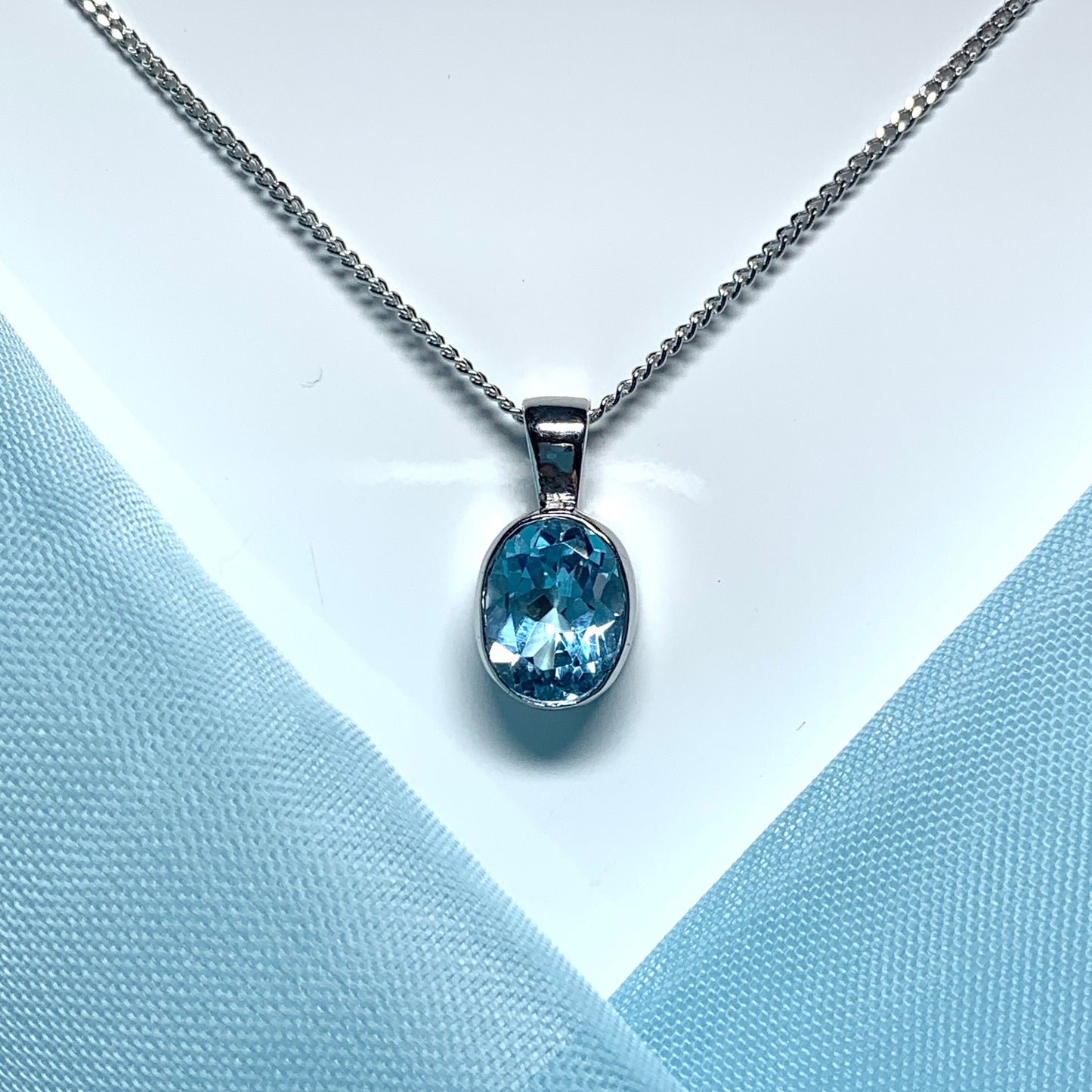 Blue topaz oval necklace white gold pendant
