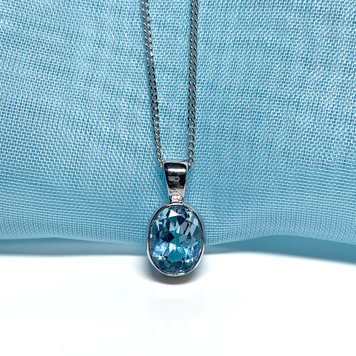 Blue topaz oval necklace white gold pendant