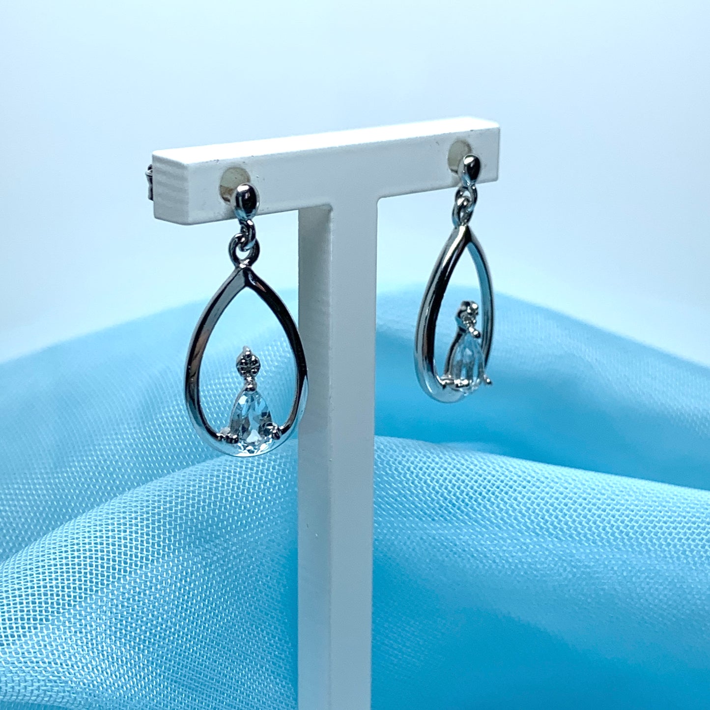 Blue topaz pear shaped sterling silver diamond set drop earrings