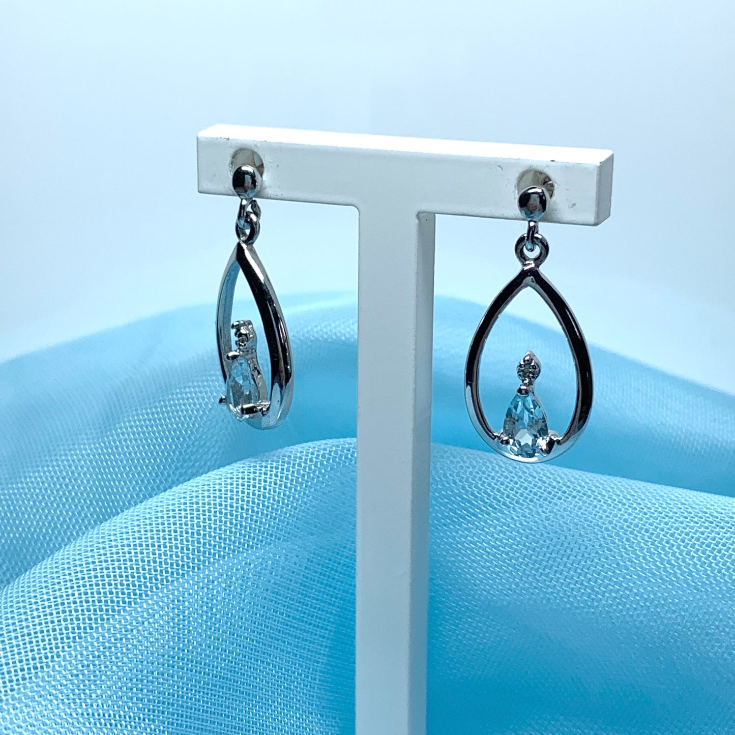 Blue topaz pear shaped sterling silver diamond set drop earrings