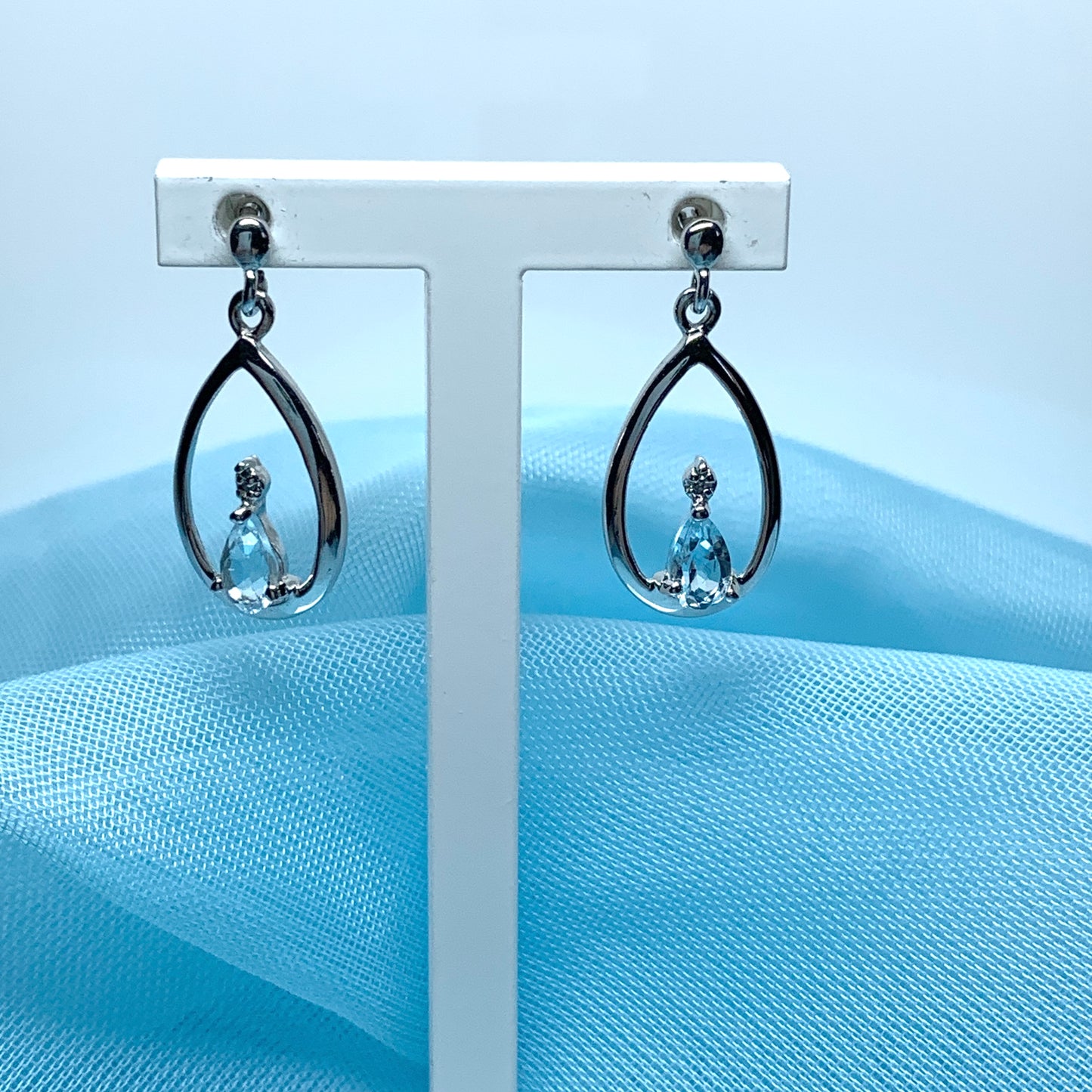 Blue topaz pear shaped sterling silver diamond set drop earrings