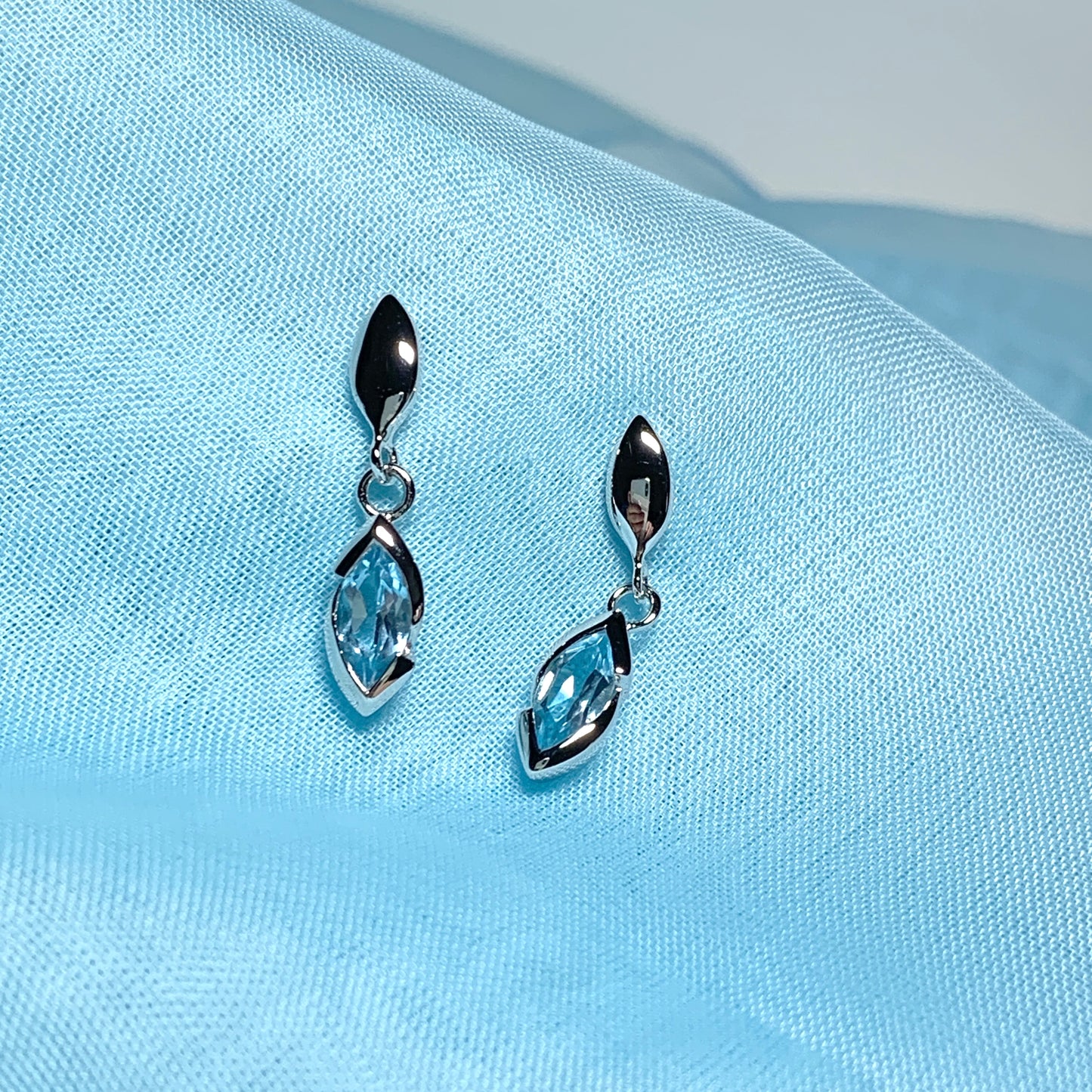 Blue topaz sterling silver marquise shaped drop earrings