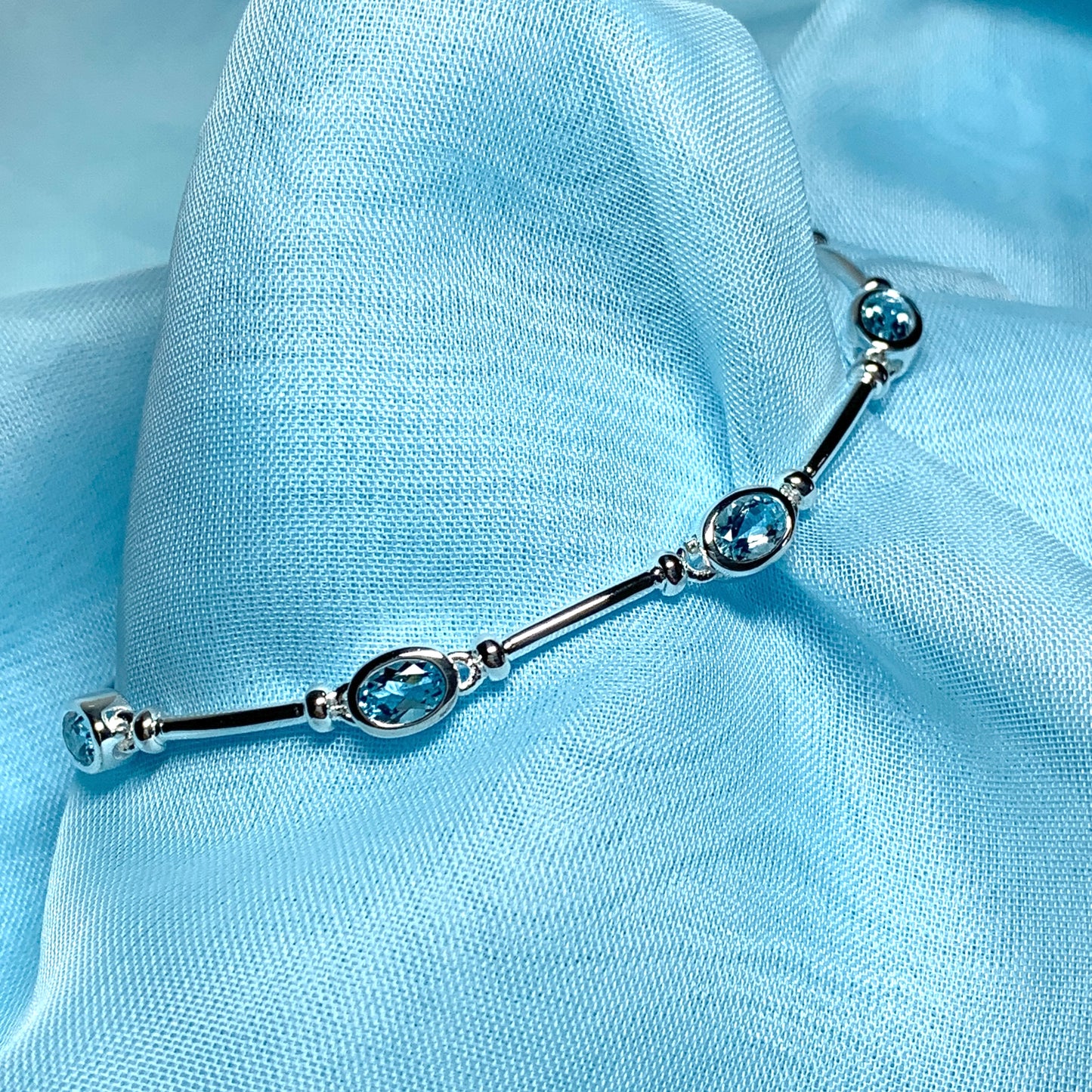 Blue topaz oval sterling silver bracelet
