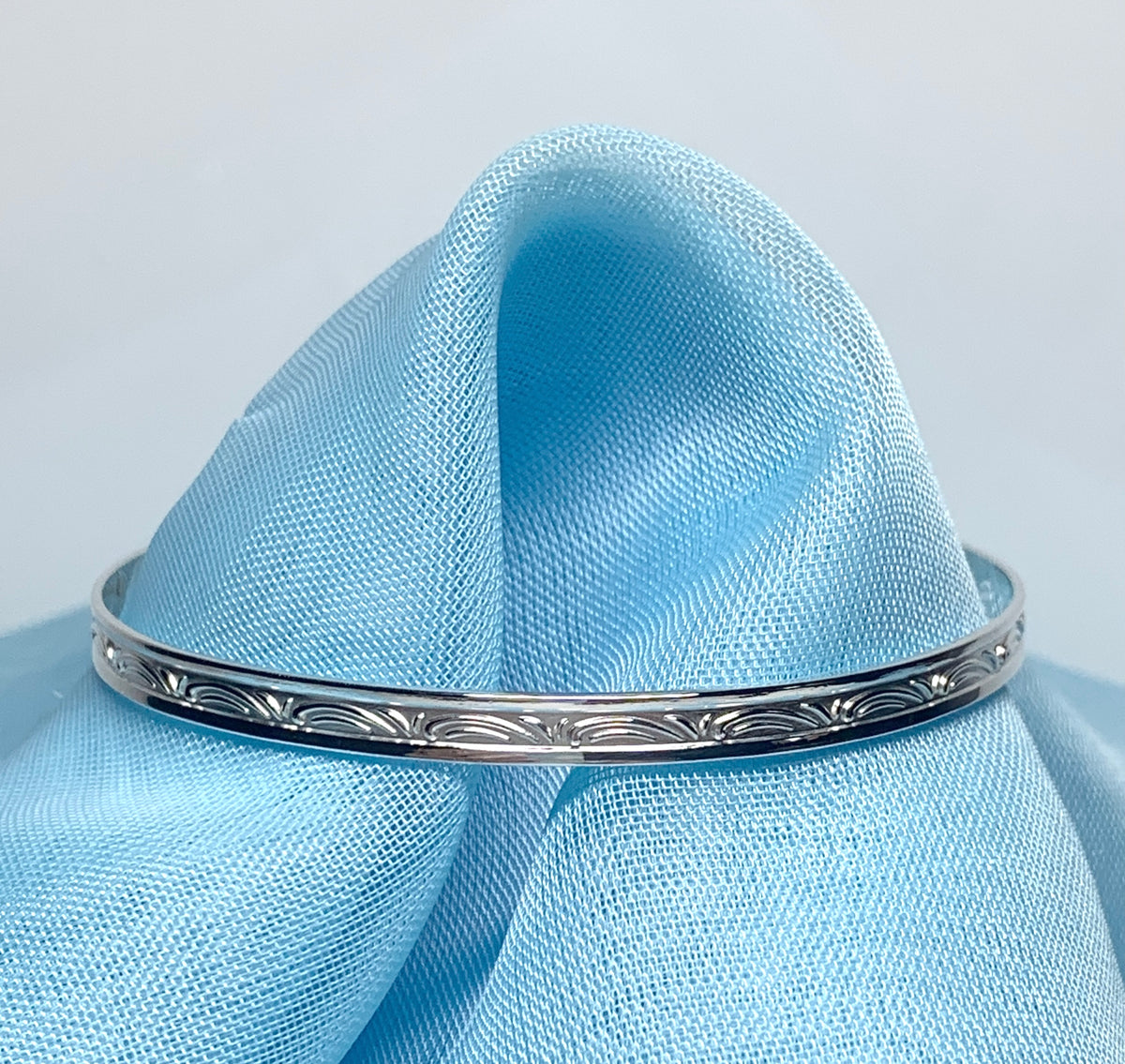Child’s expanding bangle swirl patterned design sterling silver