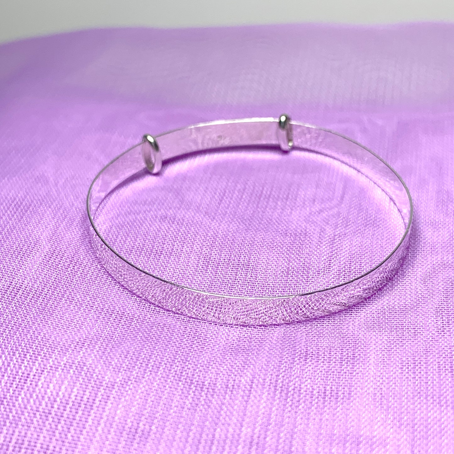 Child’s expanding bangle with a diamond cut design sterling silver