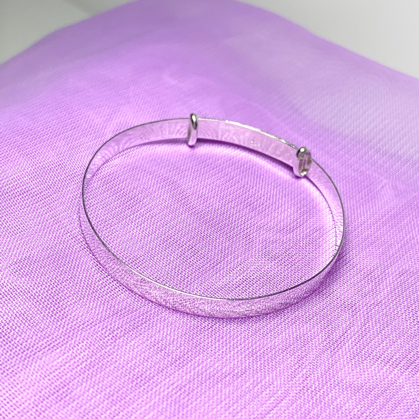 Child’s expanding bangle with a diamond cut design sterling silver