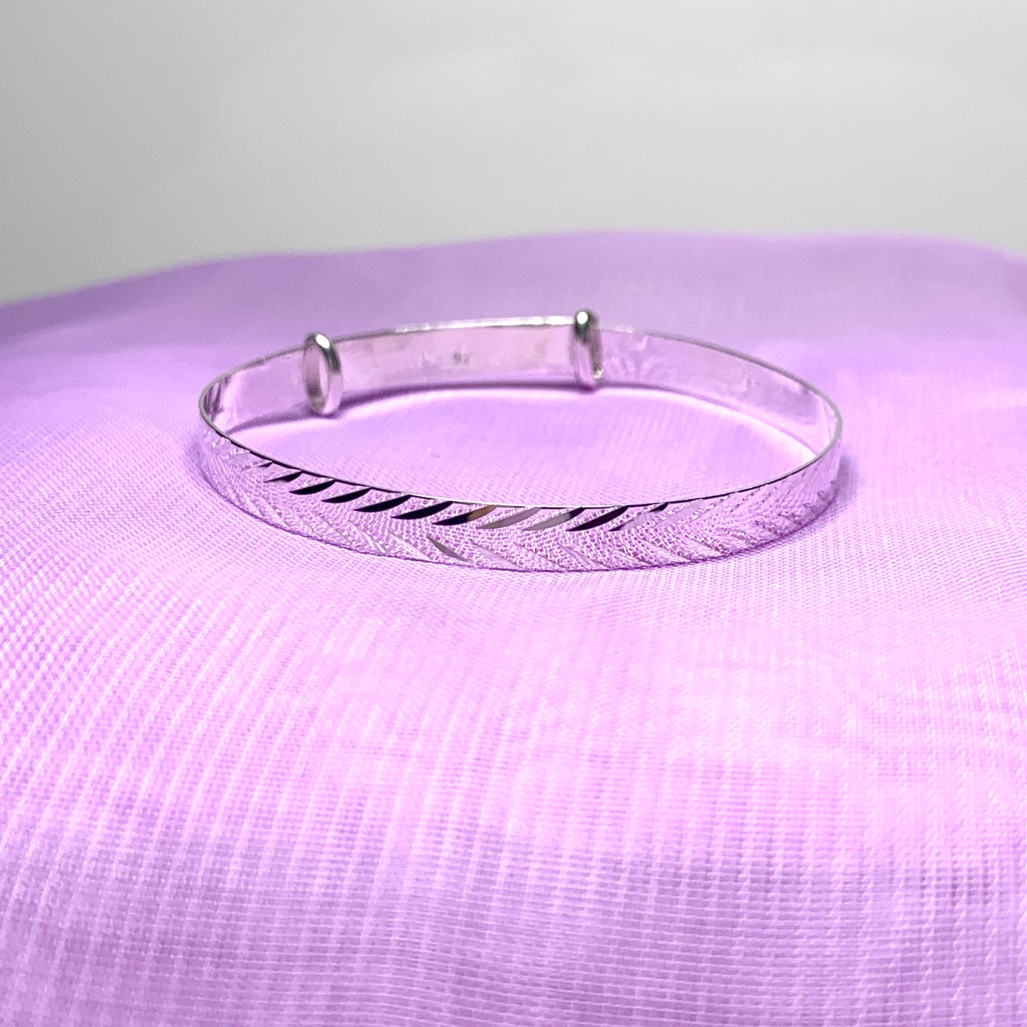 Child’s expanding bangle with a diamond cut design sterling silver