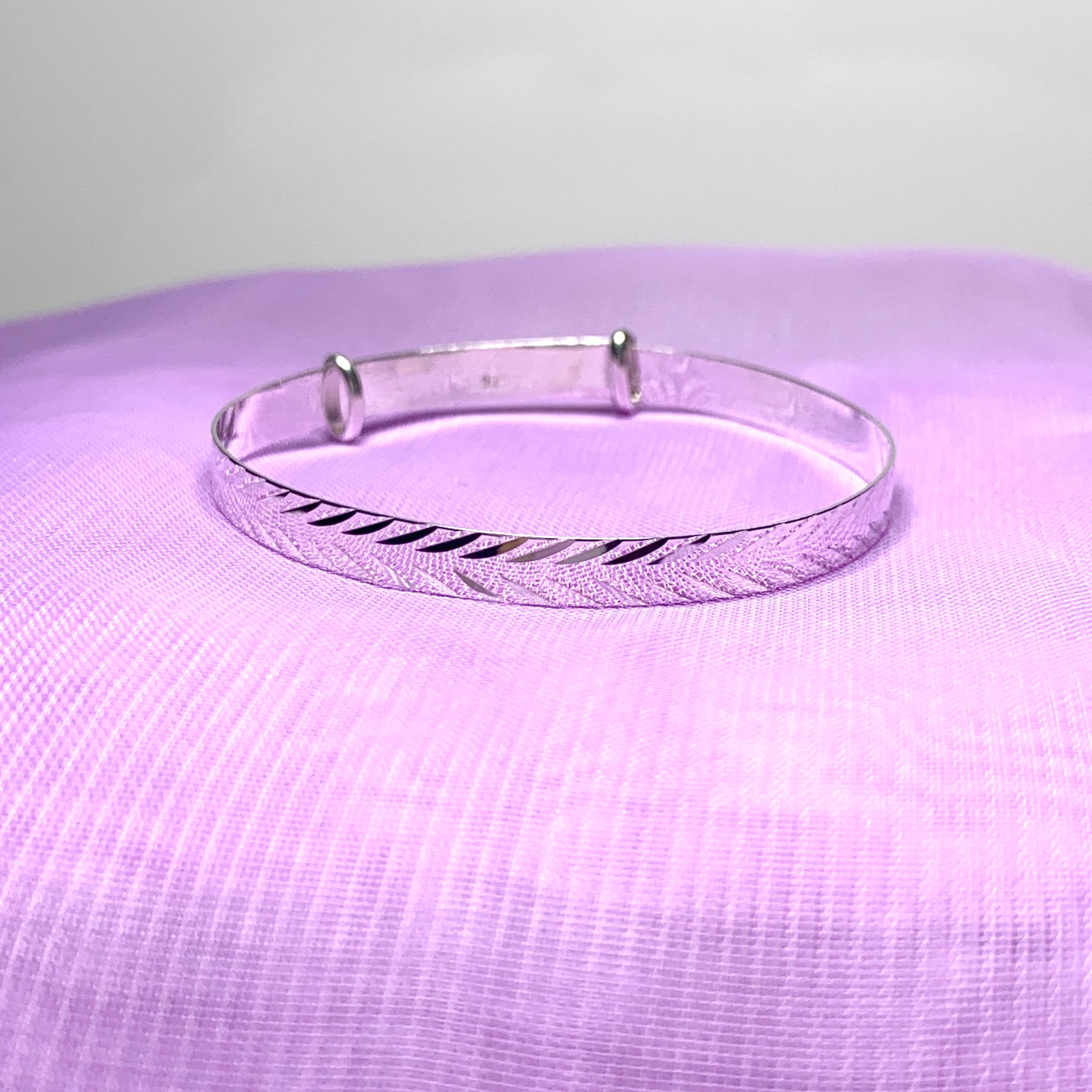 Child’s expanding bangle with a diamond cut design sterling silver