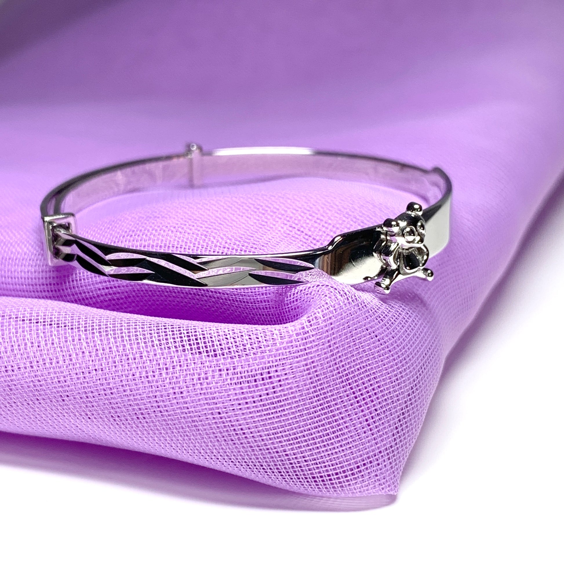 Child’s expanding bangle with a teddy bear design sterling silver