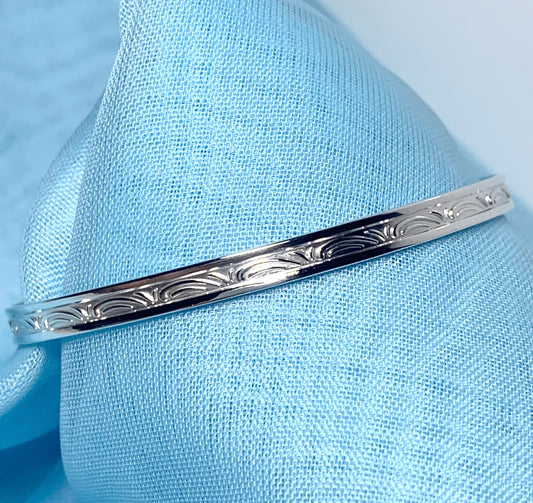 Child’s expanding bangle swirl patterned design sterling silver