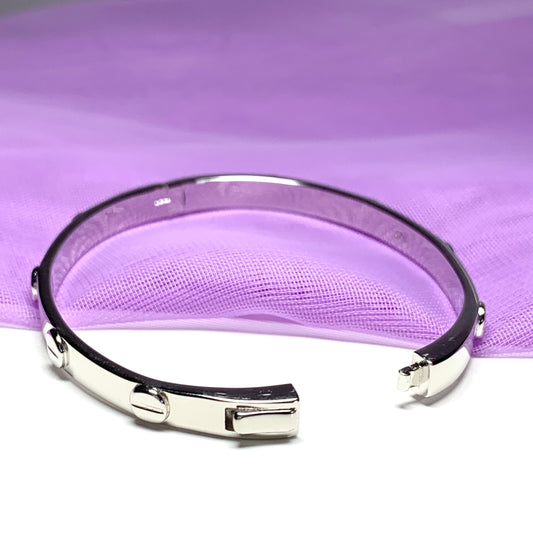 Child’s oval bangle screw head design patterned sterling silver