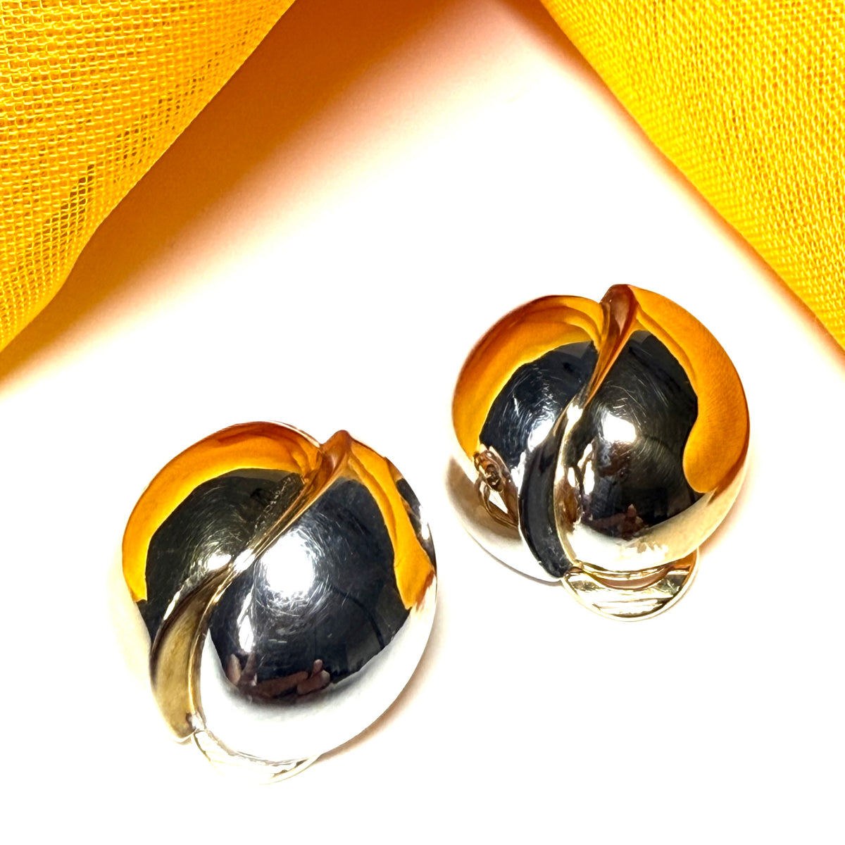 Clip on earrings with two tone yellow and white gold