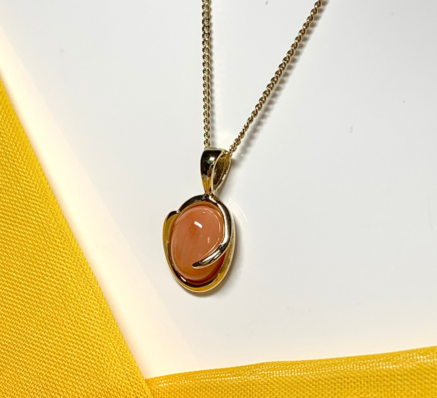 Coral yellow gold fancy oval necklace