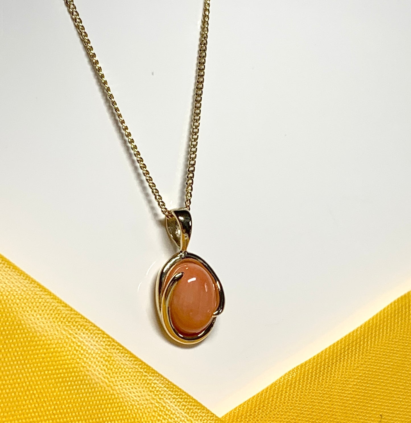 Coral yellow gold fancy oval necklace