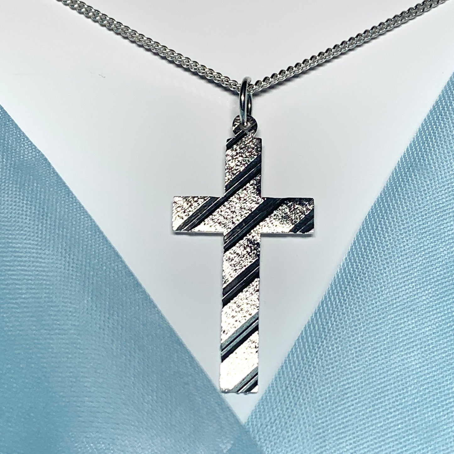 Cross patterned solid sterling silver diamond cut including chain