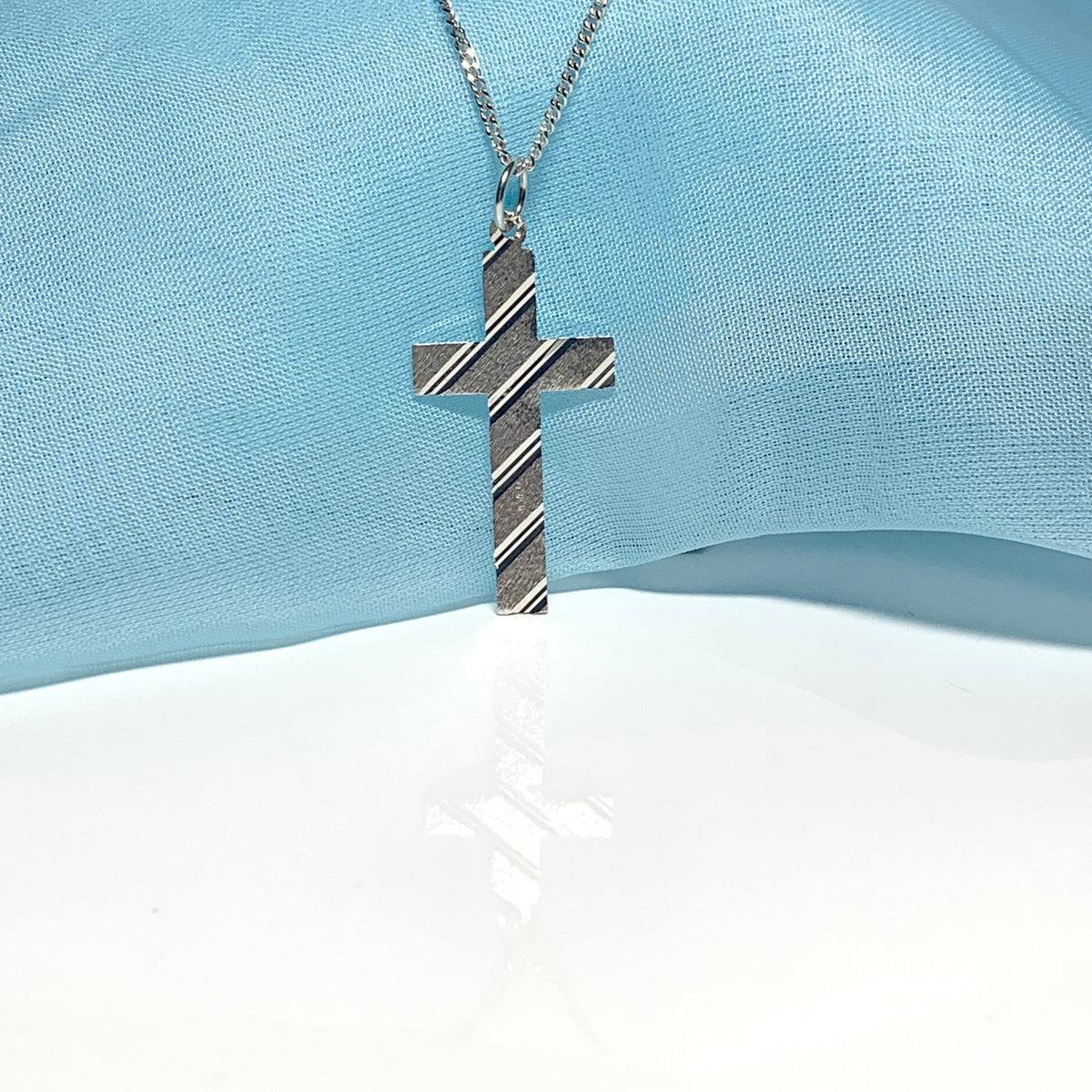 Cross patterned solid sterling silver diamond cut including chain