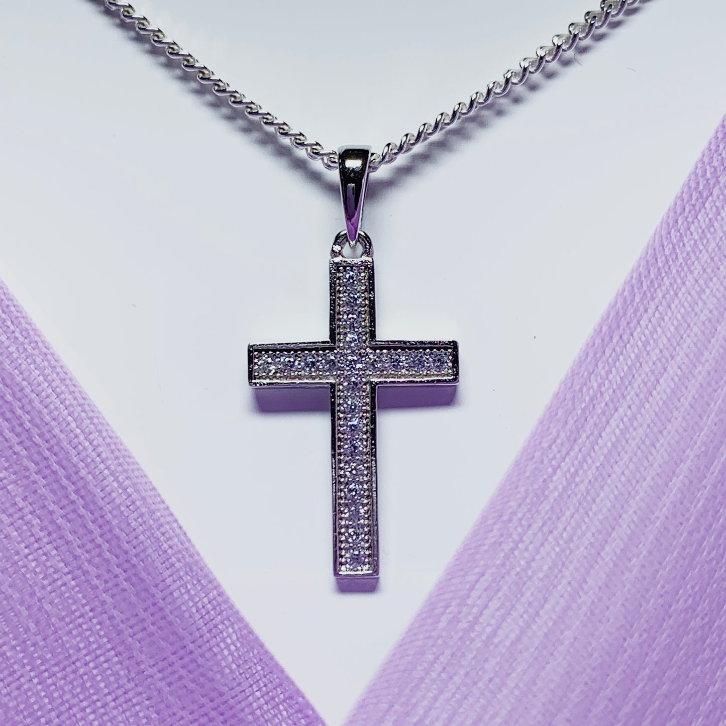 Cubic zirconia set cross including chain sterling silver